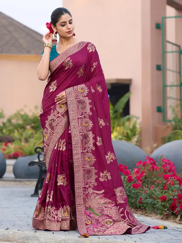 Maroon dola silk saree with stones and zari weaving