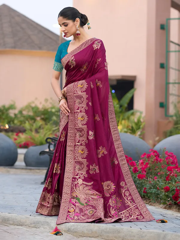 Maroon dola silk saree with stones and zari weaving