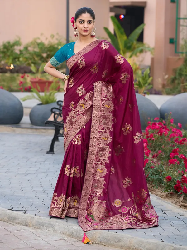 Maroon dola silk saree with stones and zari weaving
