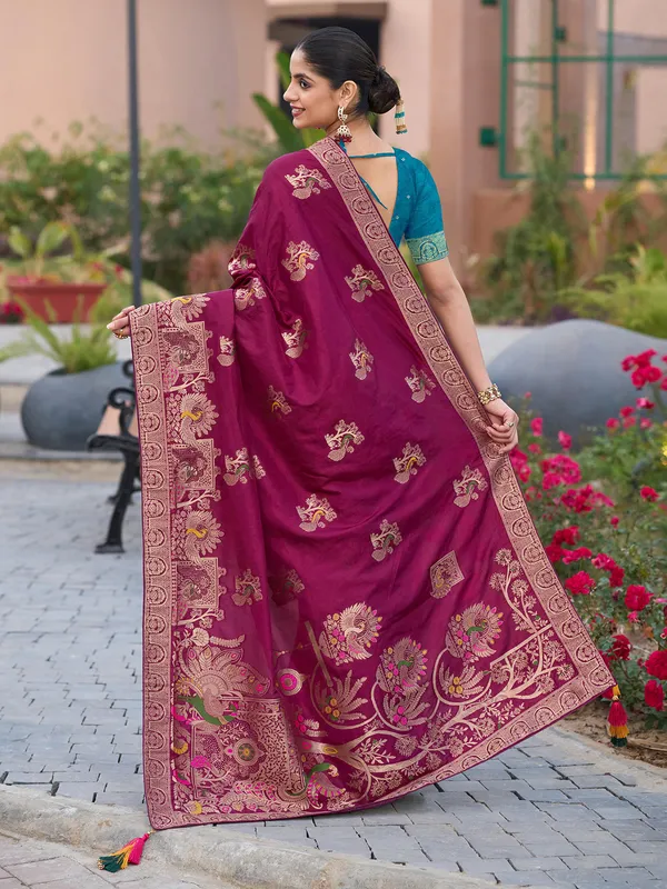 Maroon dola silk saree with stones and zari weaving