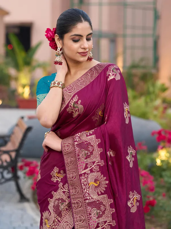 Maroon dola silk saree with stones and zari weaving