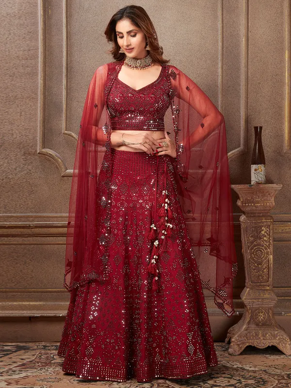 Maroon hue wedding lehenga choli in raw silk