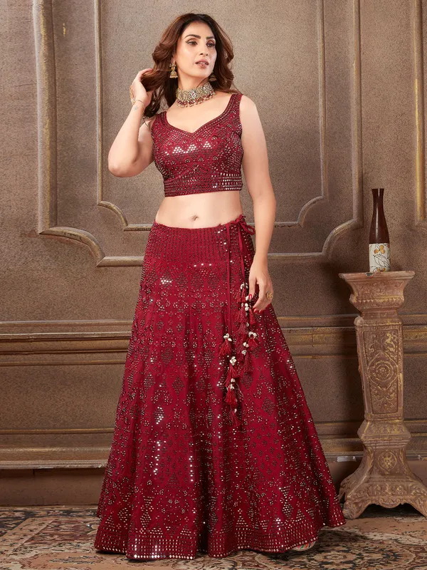 Maroon hue wedding lehenga choli in raw silk