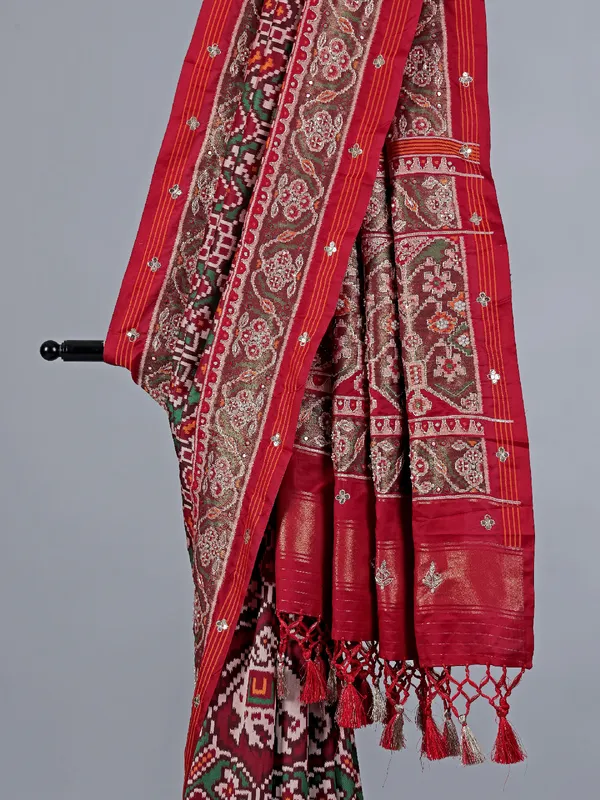 Maroon patola silk saree with zardosi highlights