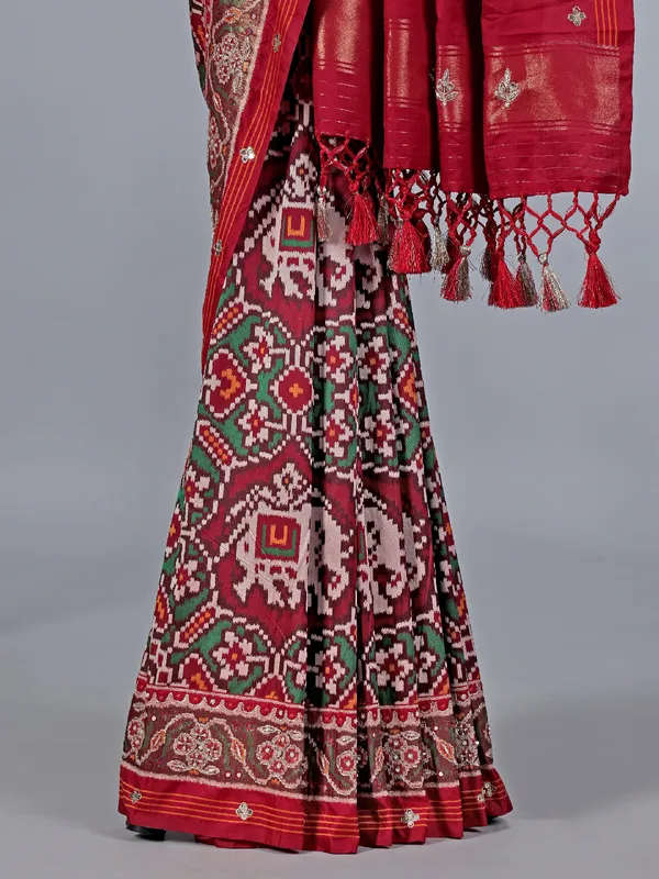 Maroon patola silk saree with zardosi highlights