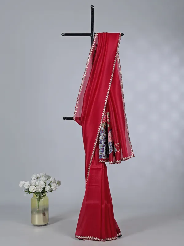 Maroon tissue silk saree with embroidered peacock motifs
