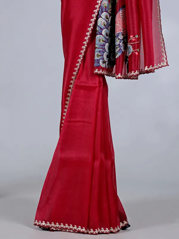 Maroon tissue silk saree with embroidered peacock motifs