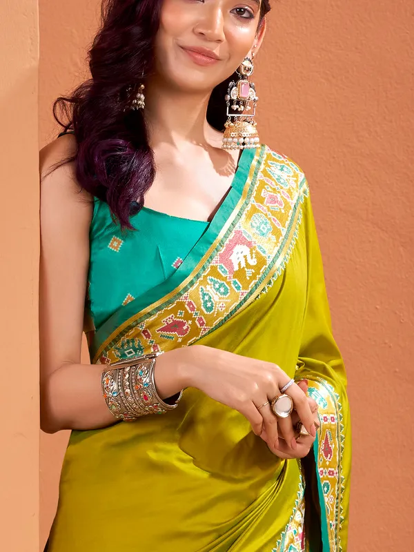 Mehendi green patola saree with traditional flair