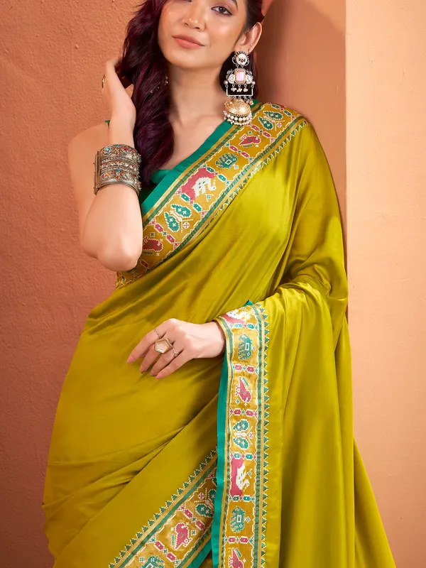 Mehendi green patola saree with traditional flair