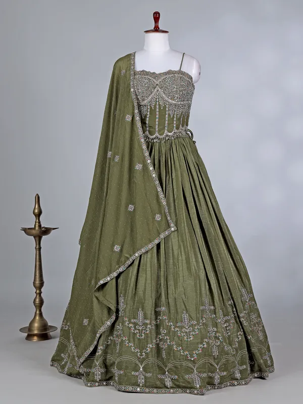Mehendi green silk lehenga choli with cutdana glow