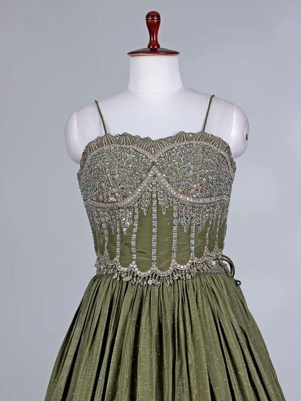 Mehendi green silk lehenga choli with cutdana glow