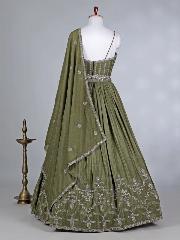 Mehendi green silk lehenga choli with cutdana glow