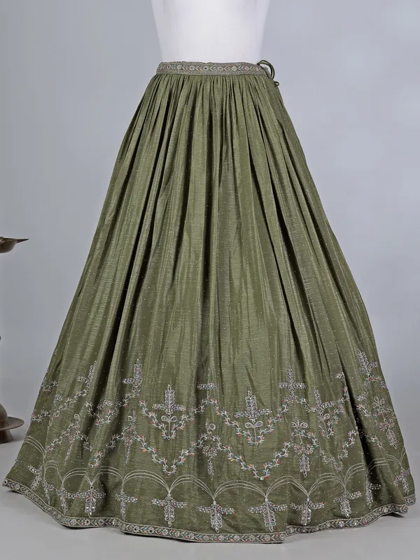 Mehendi green silk lehenga choli with cutdana glow