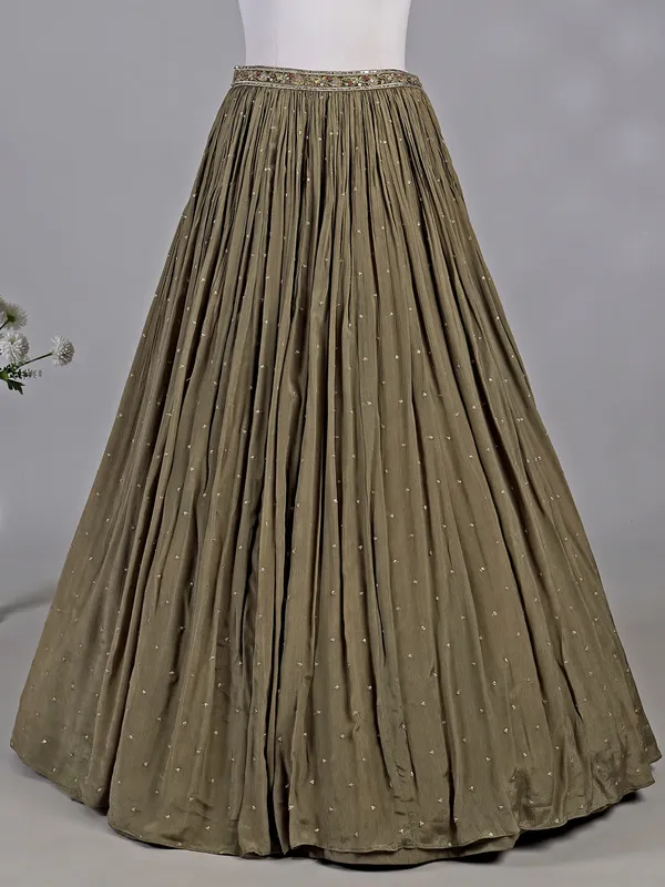 Mehendi green silk lehenga choli with zardosi accents
