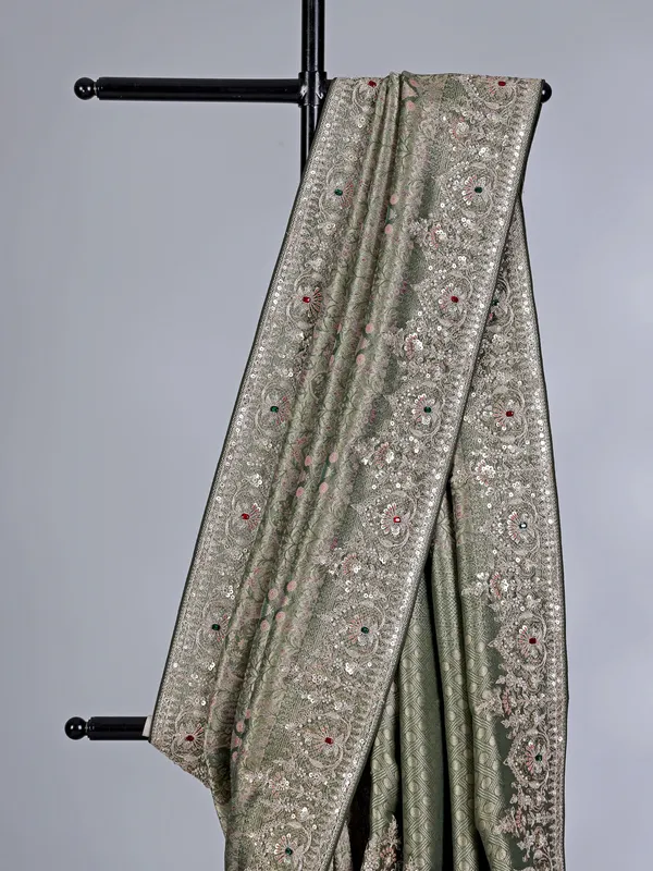 Mehendi green tissue silk saree with stone and sequin detailing