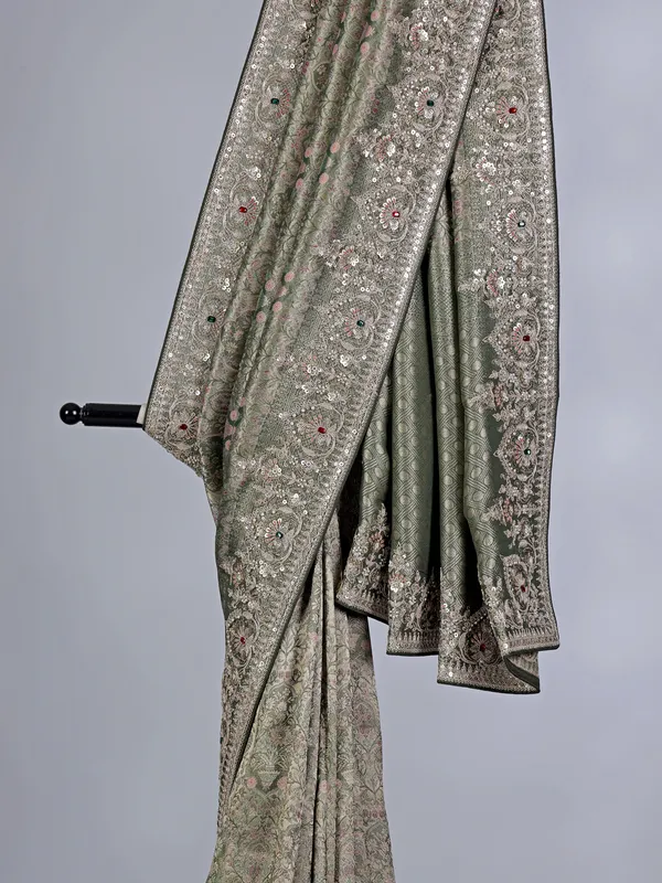 Mehendi green tissue silk saree with stone and sequin detailing