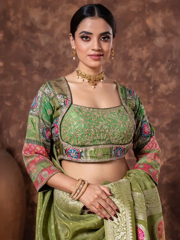 Mehendi green wedding wear tissue silk saree