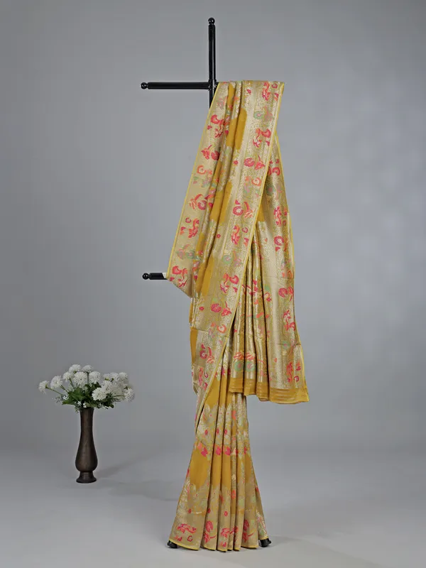 Mehendi yellow dola silk saree with colorful motifs