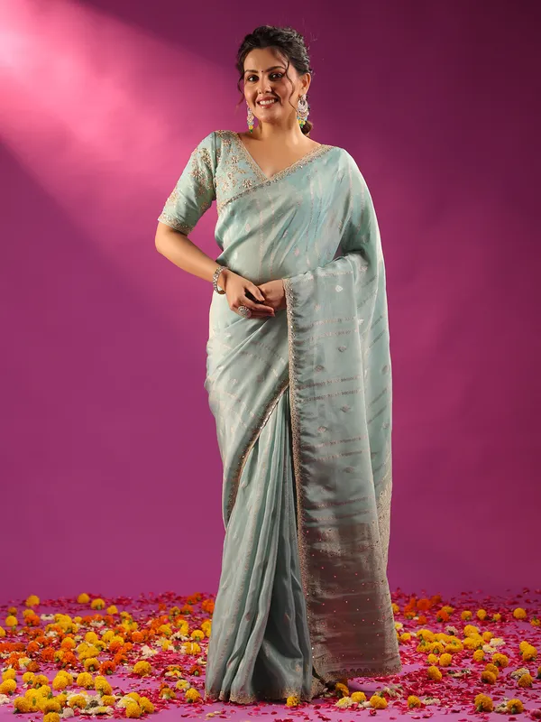 Mint blue silk saree with zari glow