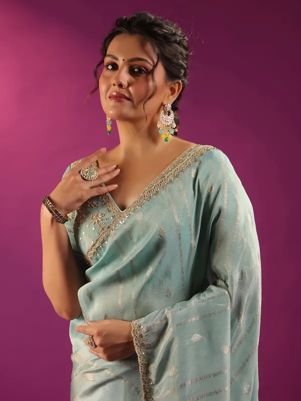 Mint blue silk saree with zari glow