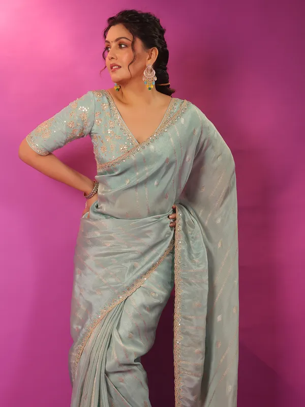 Mint blue silk saree with zari glow