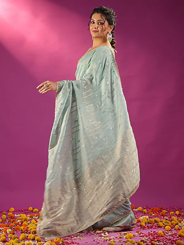 Mint blue silk saree with zari glow