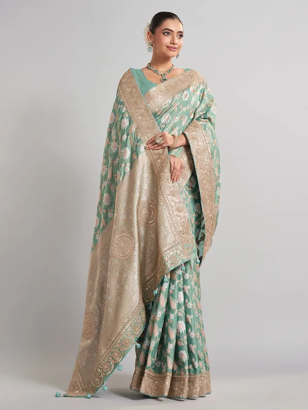 Mint green banarasi silk saree with zari weaving for weddings