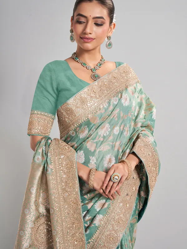 Mint green banarasi silk saree with zari weaving for weddings