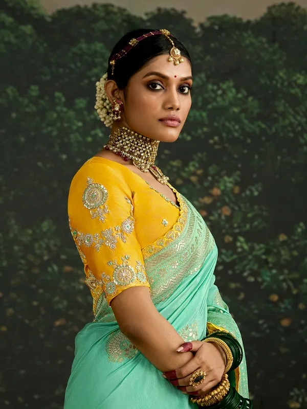 Mint green dola silk saree with zari weaving