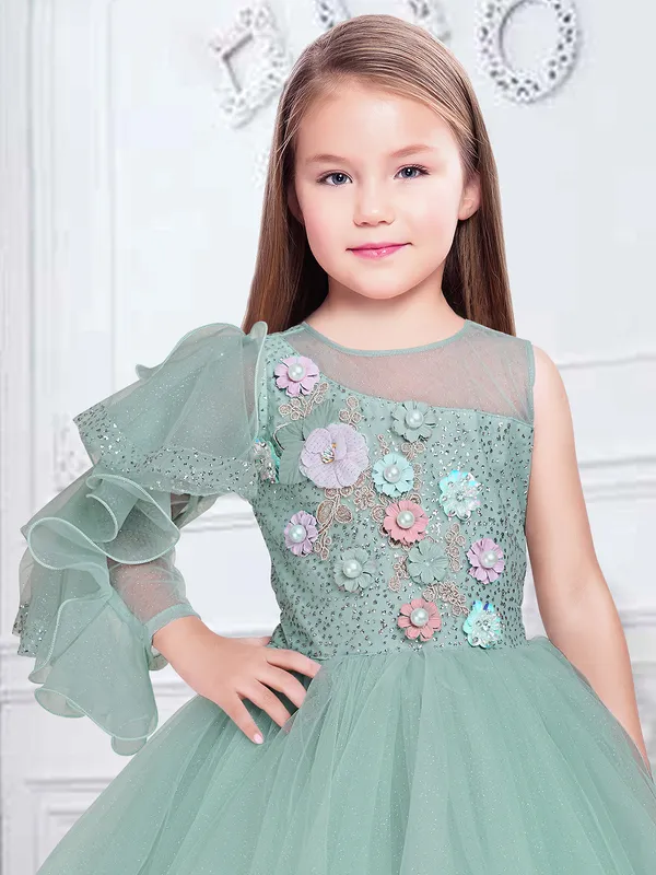 Mint green gown in net for party and reception wear