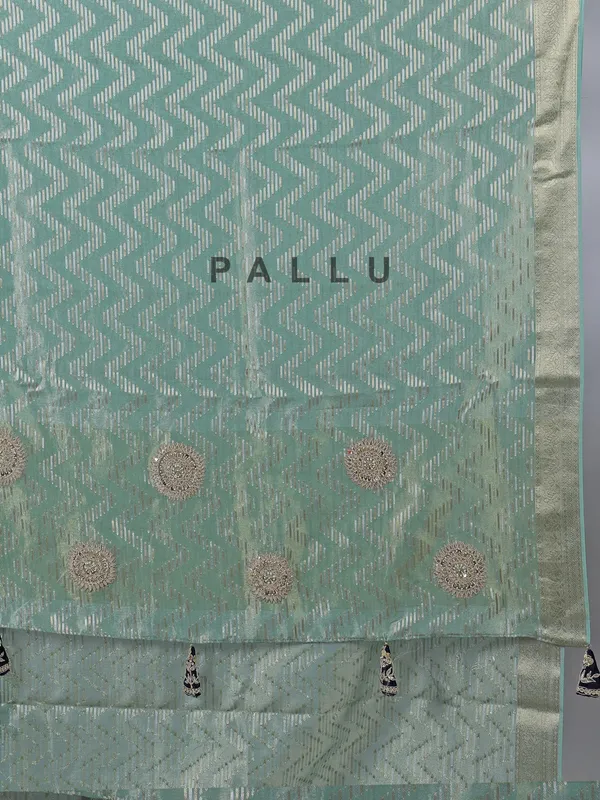 Mint green organza saree with zardosi and sequins work