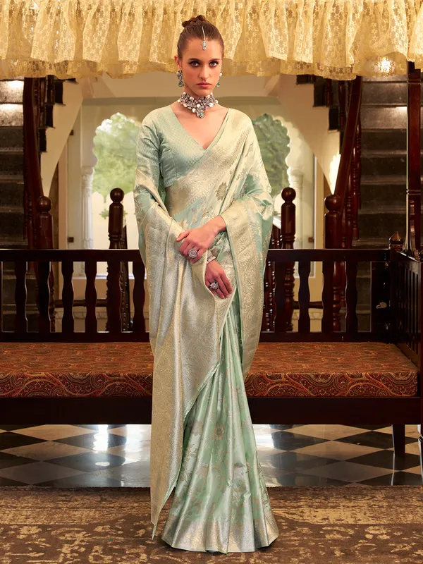 Mint green satin silk saree with zari work