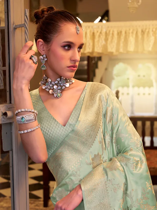Mint green satin silk saree with zari work