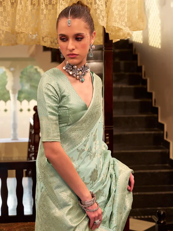 Mint green satin silk saree with zari work