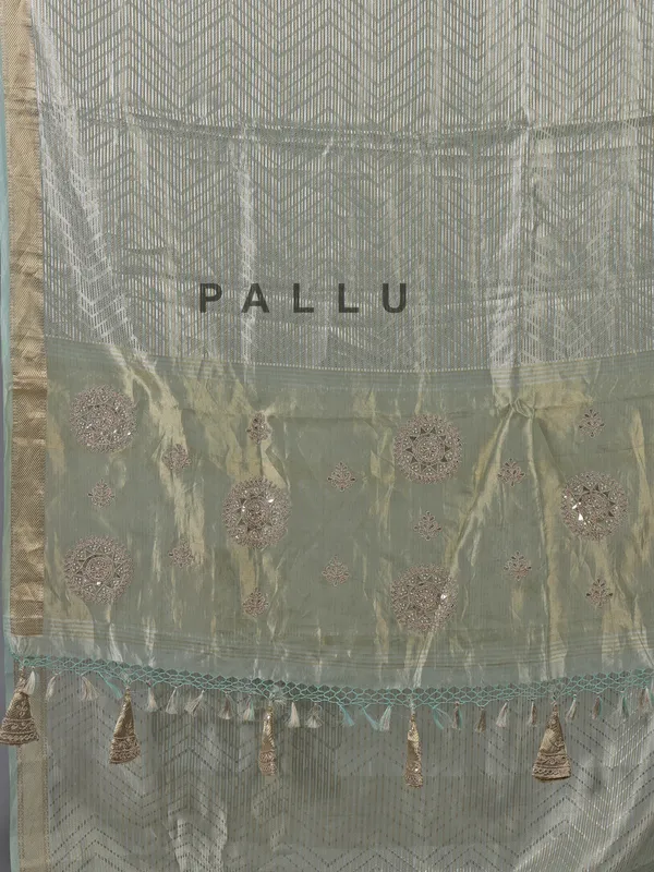 Mint green tissue silk saree with zari detailing