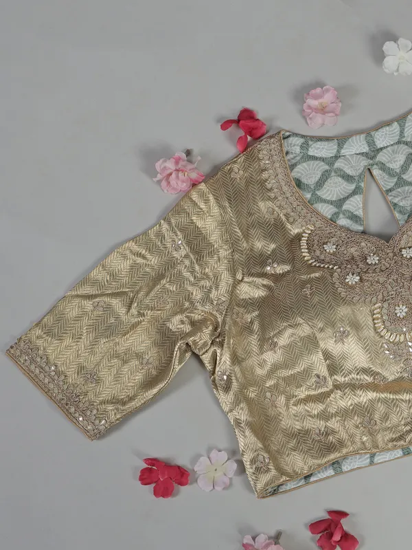 Mint green tissue silk saree with zari detailing