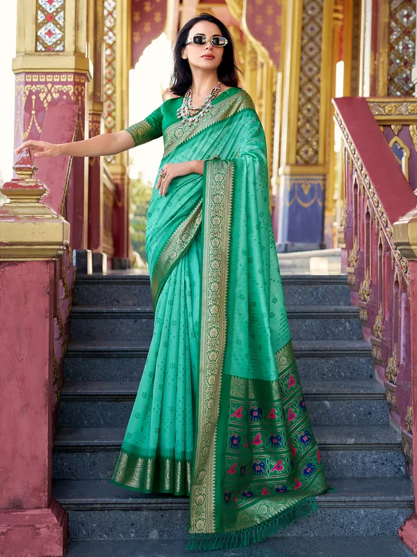Mint green tussar silk saree with zari prints