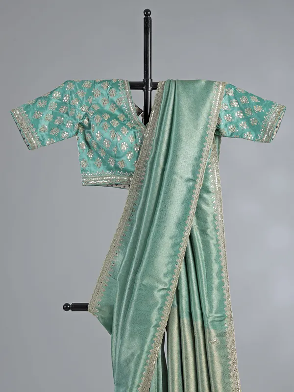 Mint green tusser dola silk saree with heavy work