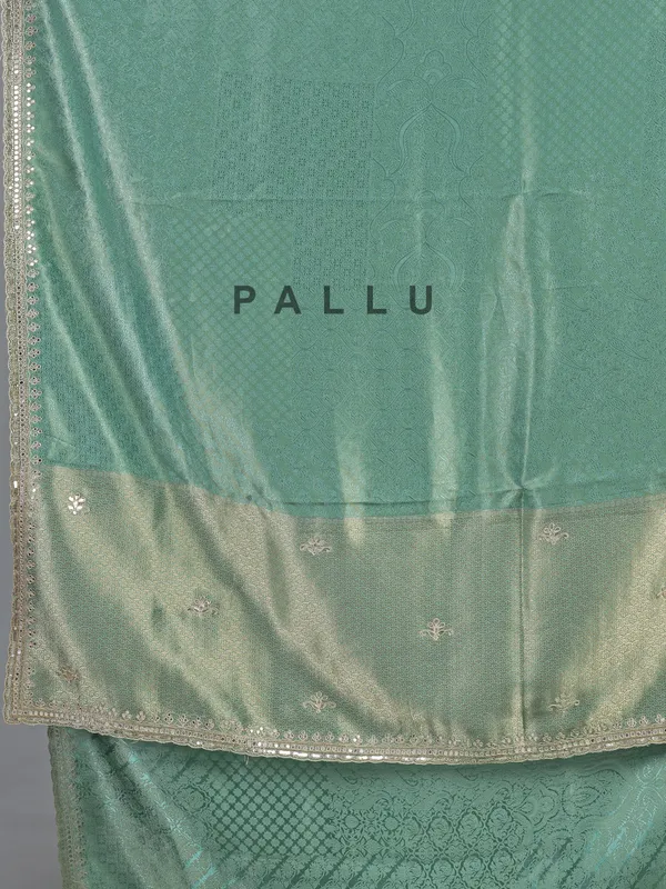 Mint green tusser dola silk saree with heavy work
