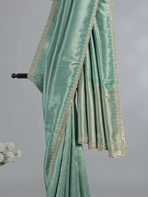 Mint green tusser dola silk saree with heavy work