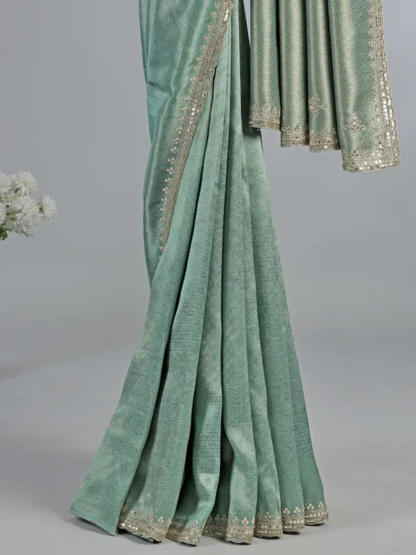 Mint green tusser dola silk saree with heavy work