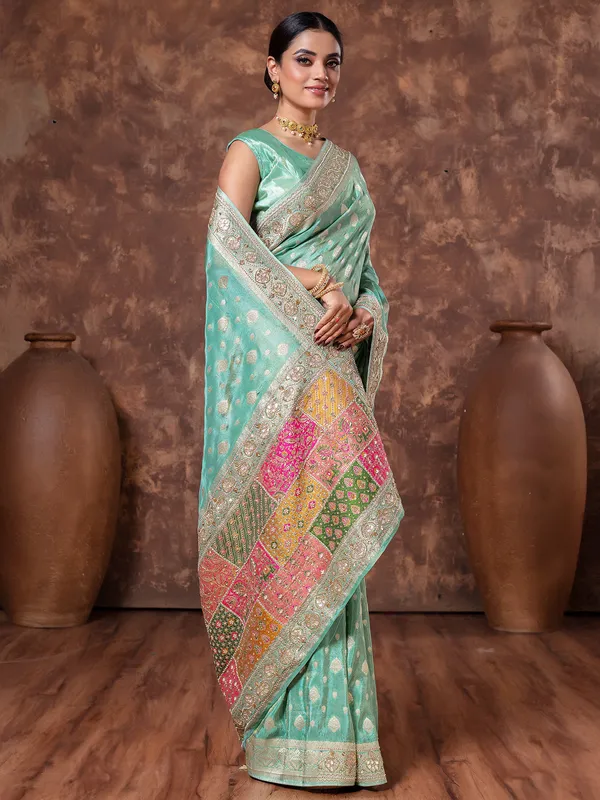 Mint green zari weaving tissue silk saree