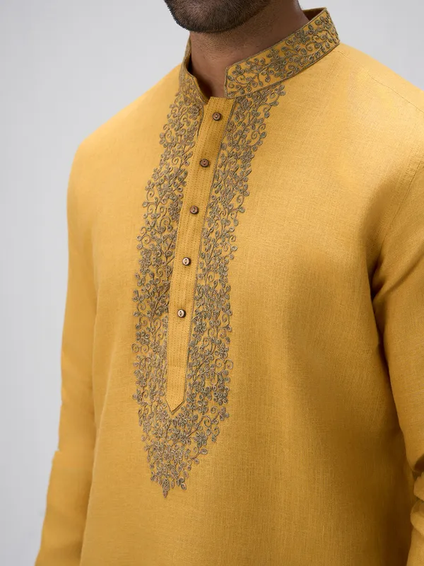 Mustard crafted thread linen kurta ensemble
