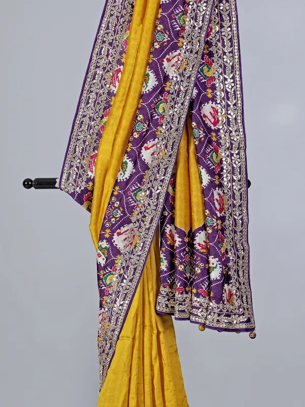Mustard yellow and purple patola silk saree