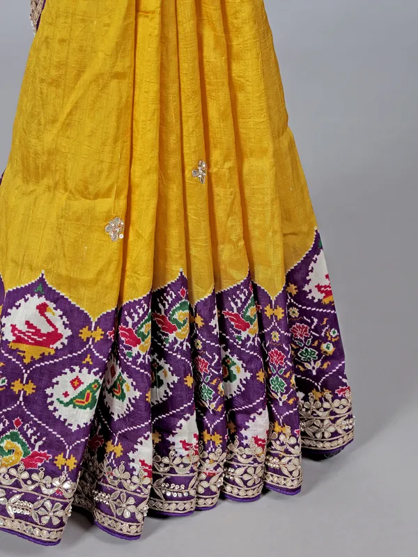 Mustard yellow and purple patola silk saree