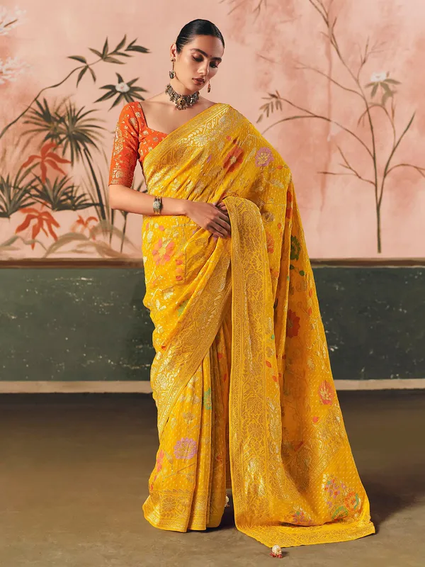 Mustard yellow bandhej zari woven georgette saree