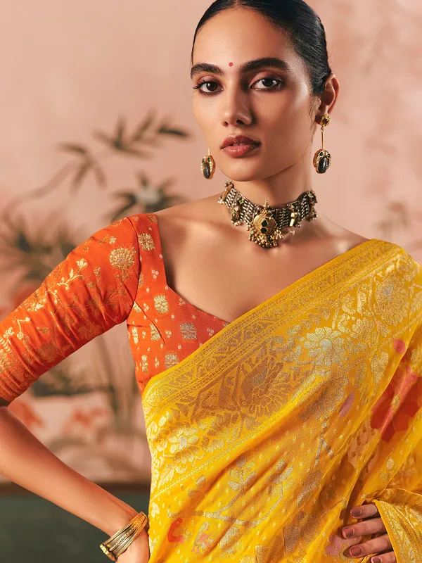 Mustard yellow bandhej zari woven georgette saree