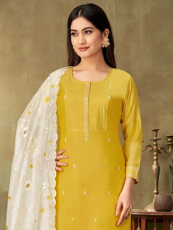 Mustard yellow cotton silk embroidered yoke style suit with dupatta