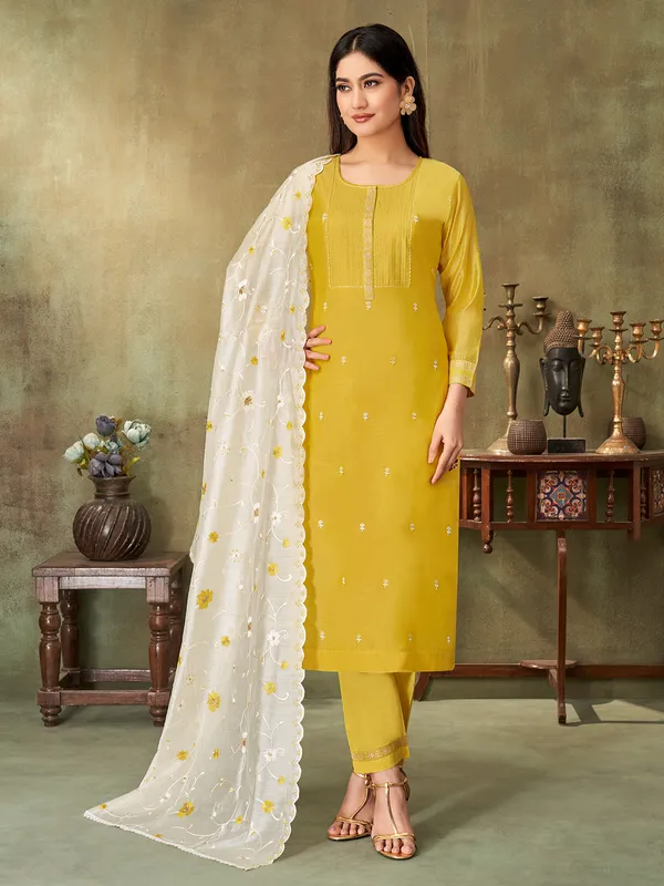 Mustard yellow cotton silk embroidered yoke style suit with dupatta