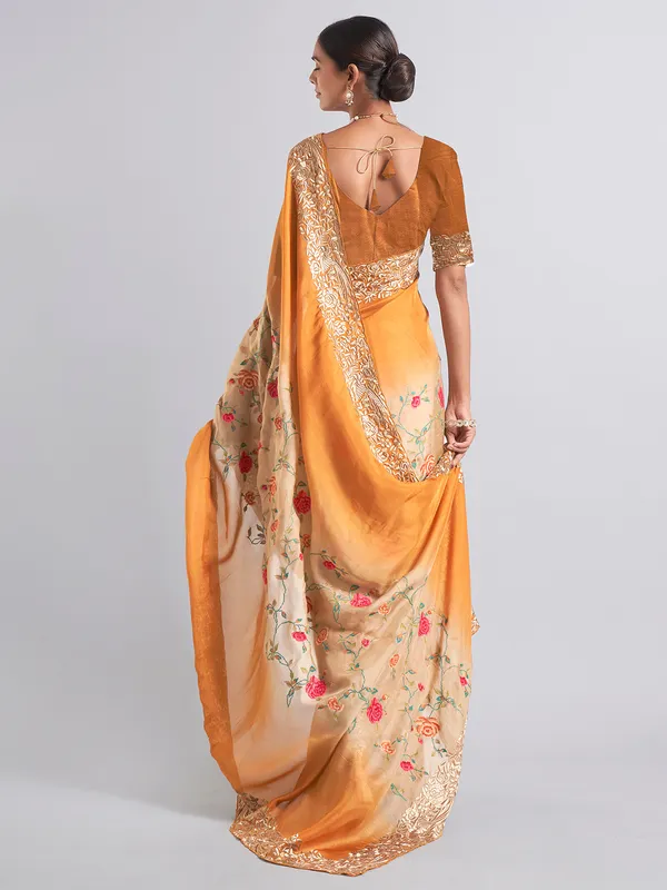 Mustard yellow georgette saree for reception